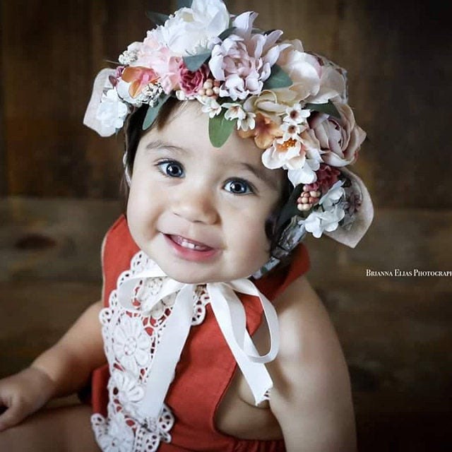 birthday pictures with rust linen romper and flower crown