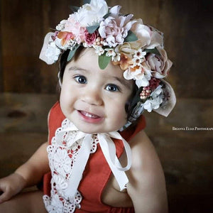 birthday pictures with rust linen romper and flower crown